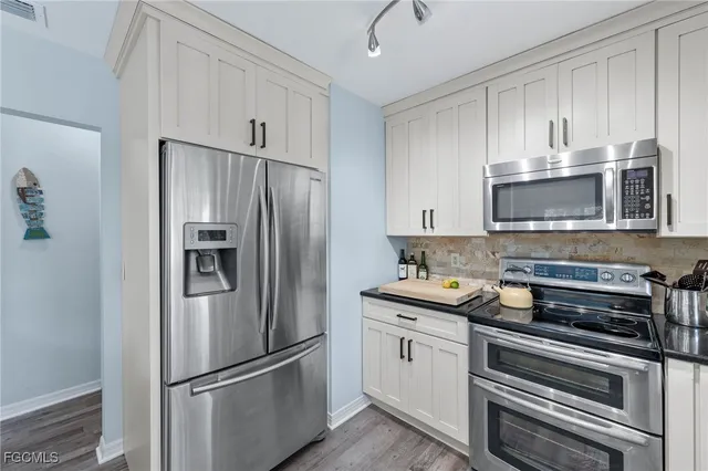 a bedroom with a large bed and a large window