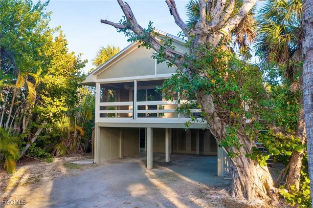 a front view of a house with a yard and a garage