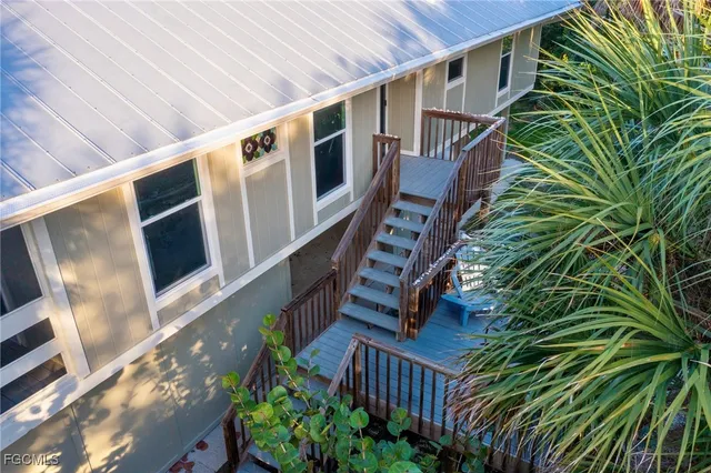 a view of balcony with wooden floor and outdoor seating