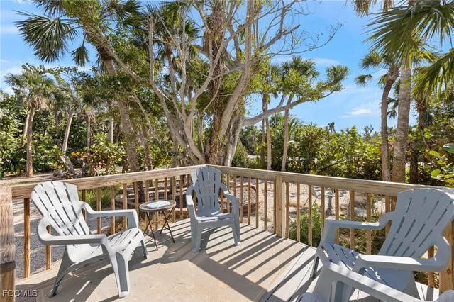a view of a balcony with wooden fence