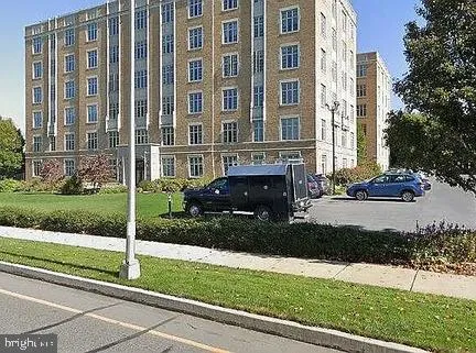 a view of a house with a yard and plants