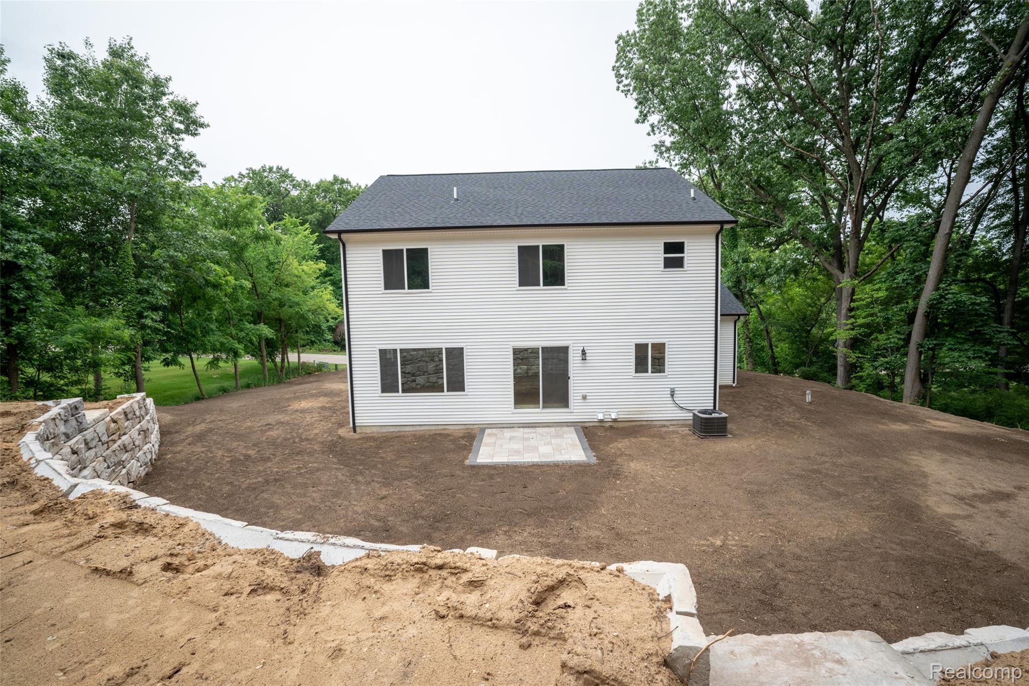 16085 Catalpa Ridge Holly, MI 48442 - Photo 25 of 40 White siding residence with a dark shingled roof