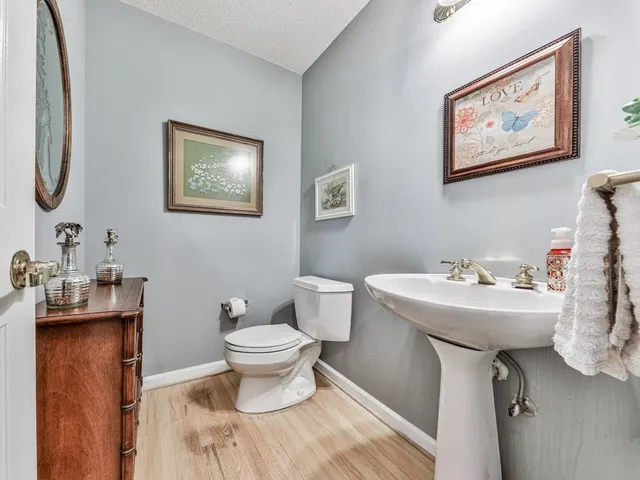 a view of a hallway with a wooden floor
