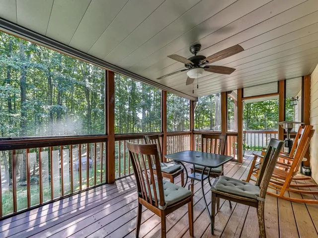a view of a livingroom with furniture and hardwood floor