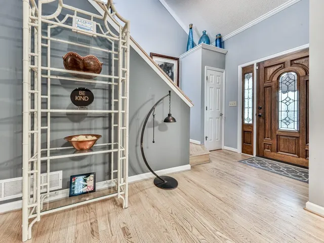 a view of an entryway with wooden floor