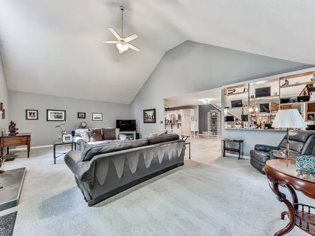 a bed room with furniture and a large window