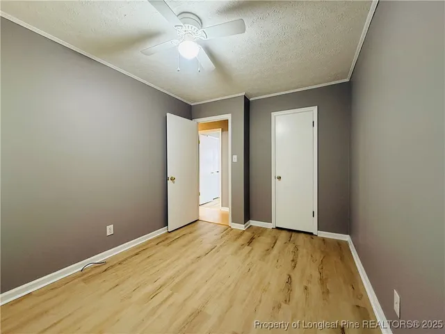 a view of a big room with wooden floor and closet