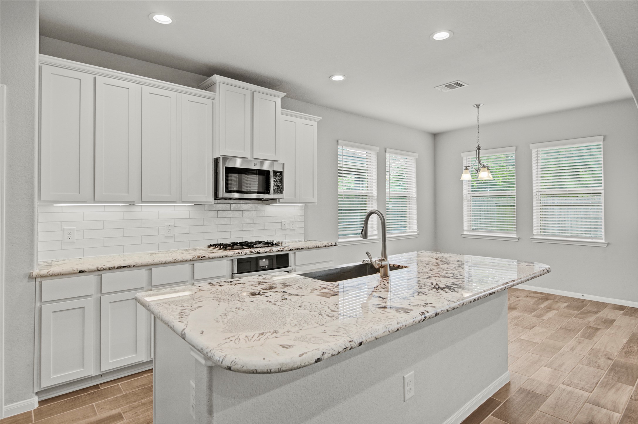 1314 Orchard Ridge Lane Tomball, TX 77375 - Photo 15 of 35 The breakfast nook is filled with natural light and offers a comfortable space for casual dining.
