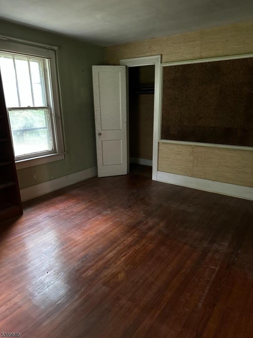 218 Highway 31 Hampton, NJ 08827 - Photo 11 of 18 an empty room with wooden floor and windows