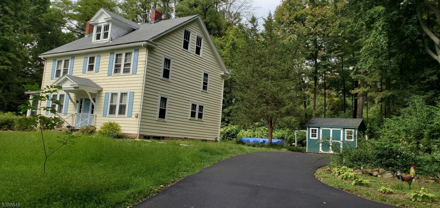 218 Highway 31 Hampton, NJ 08827 - Photo 18 of 18 a front view of a house with a yard and trees