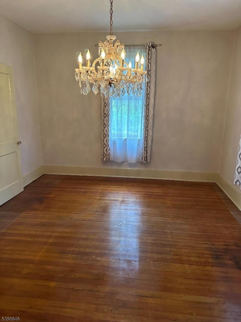 218 Highway 31 Hampton, NJ 08827 - Photo 7 of 18 a view of a room with wooden floor and chandelier