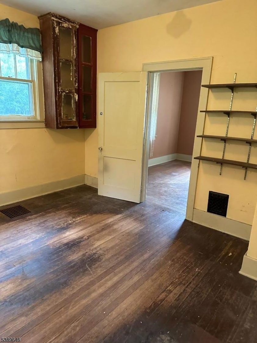 218 Highway 31 Hampton, NJ 08827 - Photo 9 of 18 an empty room with wooden floor and windows