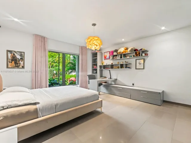a living room with furniture wooden floor and window