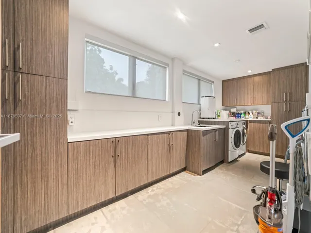 a view of a house with a swimming pool and sitting area
