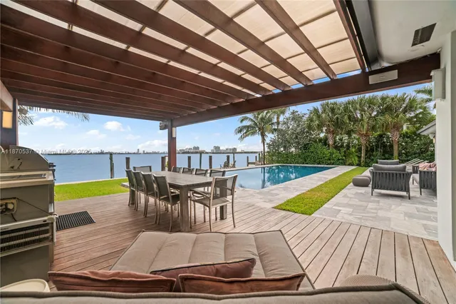 swimming pool view with a seating space