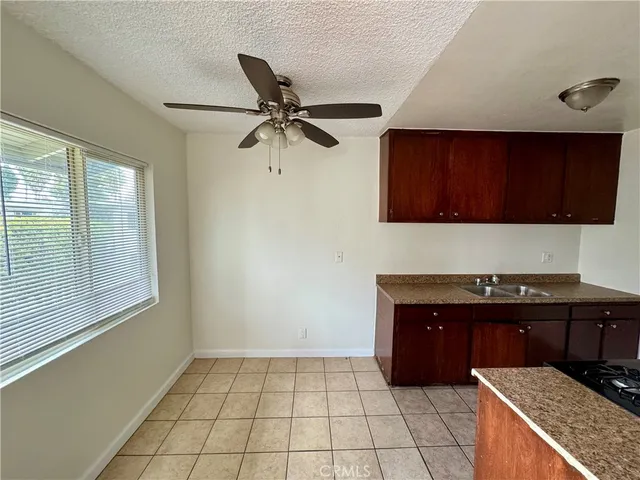 a kitchen with a cabinets and window