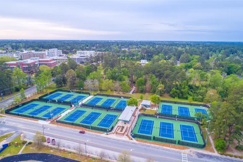 a view of balcony with yard and outdoor seating