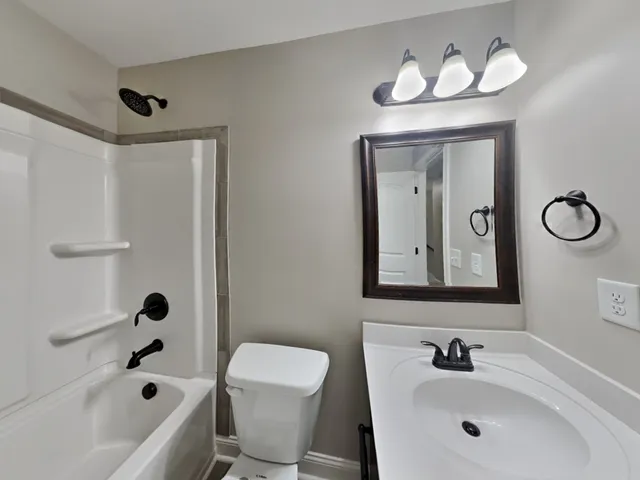 a bathroom with a shower and a bathtub