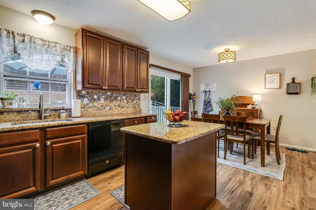 a kitchen with sink and cabinets