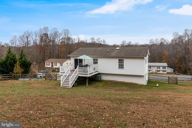 a view of a house with yard and utility room