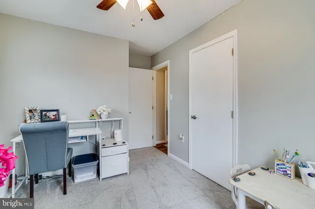 a room with a desk and a window