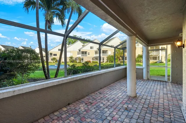 a view of a hallway with a glass door