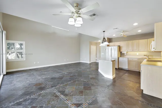 a view of a kitchen with a sink cabinets and window