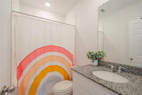 a room with furniture and baby bed