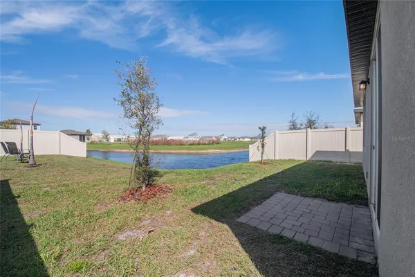 an aerial view of a residential houses with outdoor space