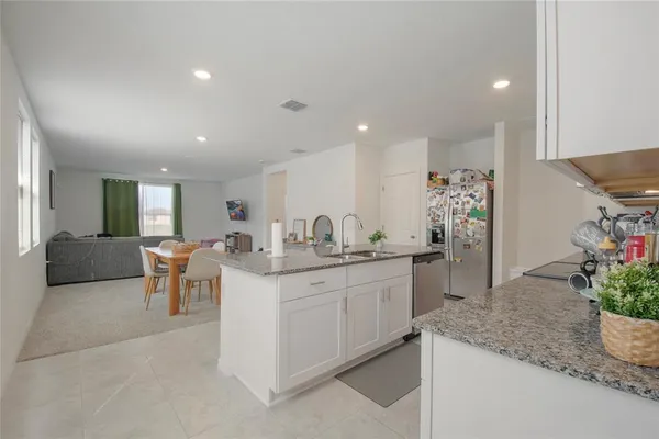 a kitchen with sink and microwave