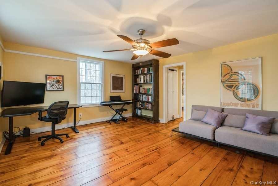 1141 Beekman Road Hopewell Junction, NY 12533 - Photo 23 of 36 a living room with furniture and a flat screen tv