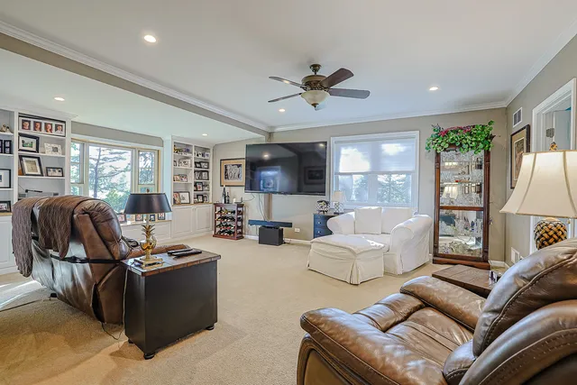 a bathroom with a granite countertop sink toilet and mirror