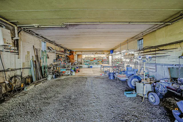 a view of a house with a yard and plants
