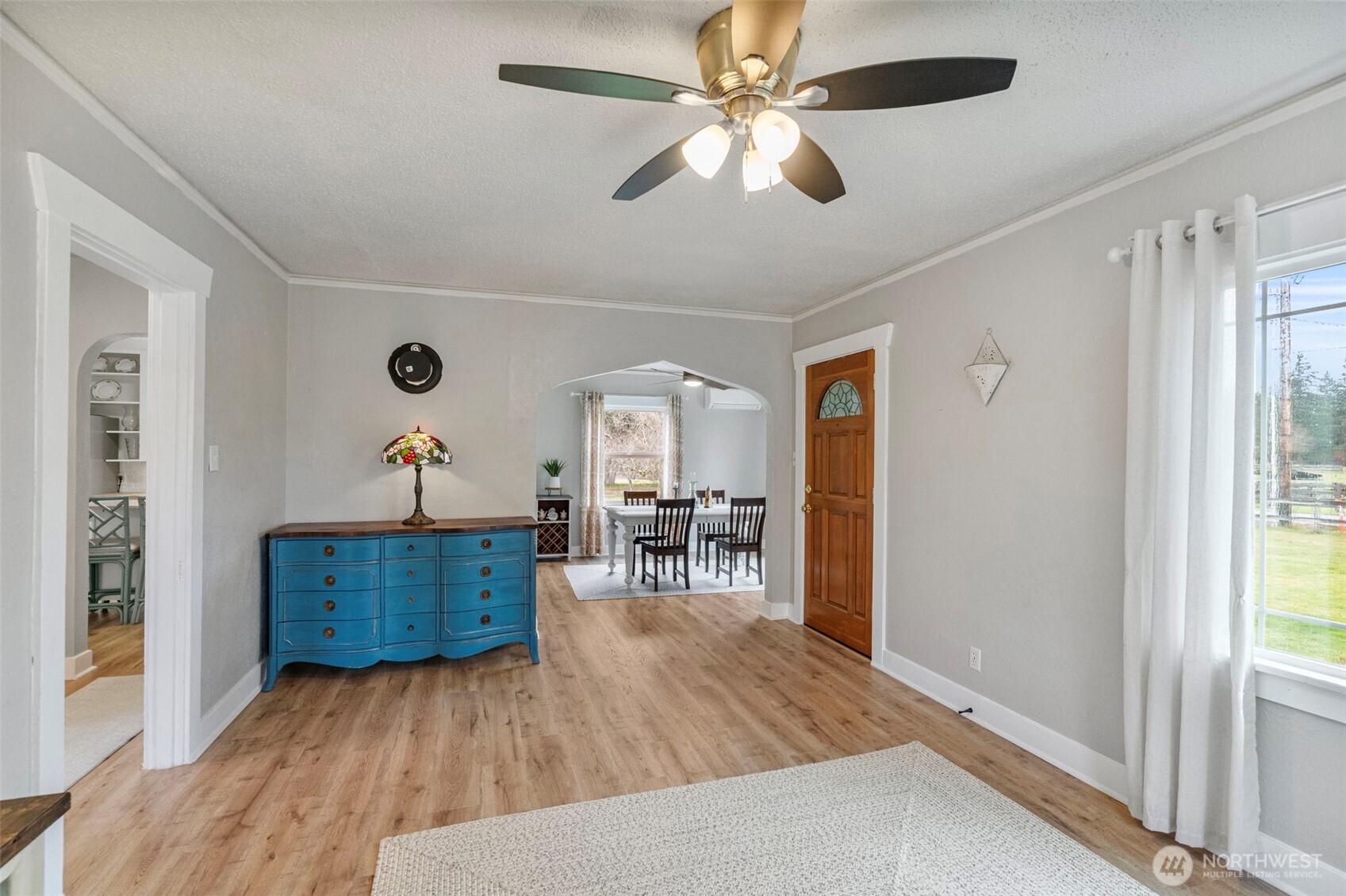 862 King Road Winlock, WA 98596 - Photo 12 of 40 an empty room with wooden floor and ceiling fan