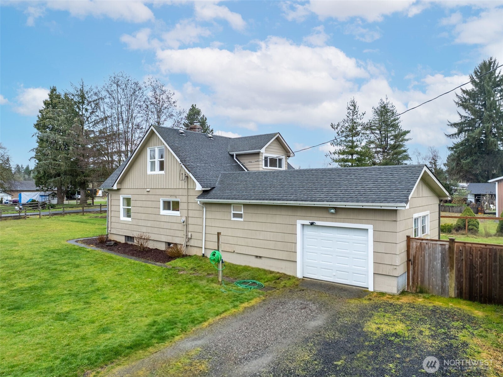 862 King Road Winlock, WA 98596 - Photo 6 of 40 a front view of a house with a yard and garage