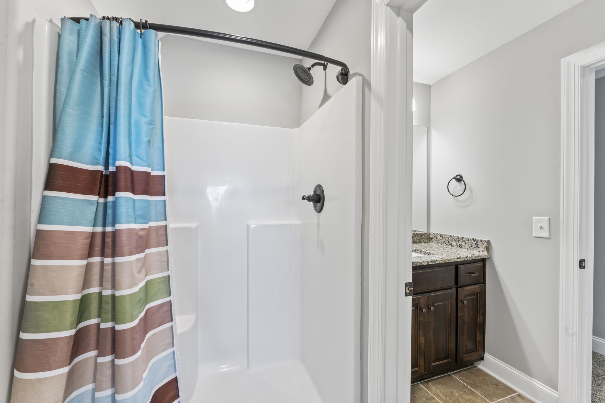 203 County Line Road Bell Buckle, TN 37020 - Photo 23 of 31 a bathroom with a granite countertop shower and a sink
