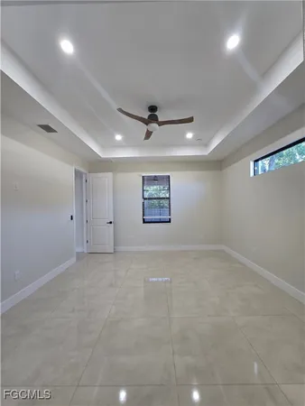 an empty room with a ceiling fan