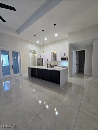 a large bathroom with a sink and mirror