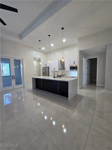 a large bathroom with a sink and mirror