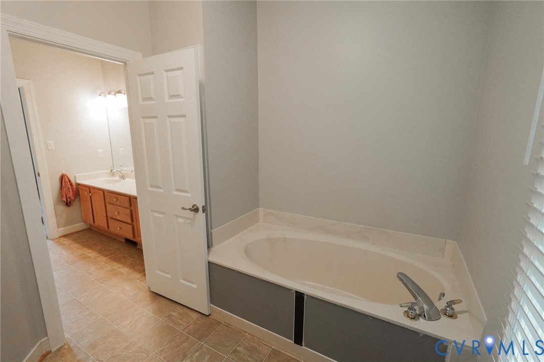 1670 Mill Quarter Road Powhatan, VA 23139 - Photo 14 of 24 Primary Bathroom featuring a soaking tub with dual