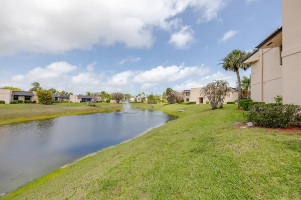 a view of a lake with houses in the back