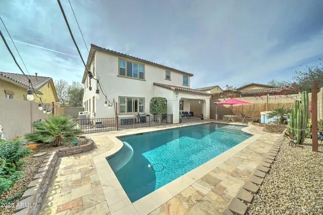 a view of a house with a swimming pool