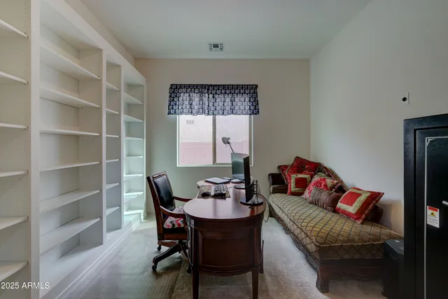 a workspace with furniture and window