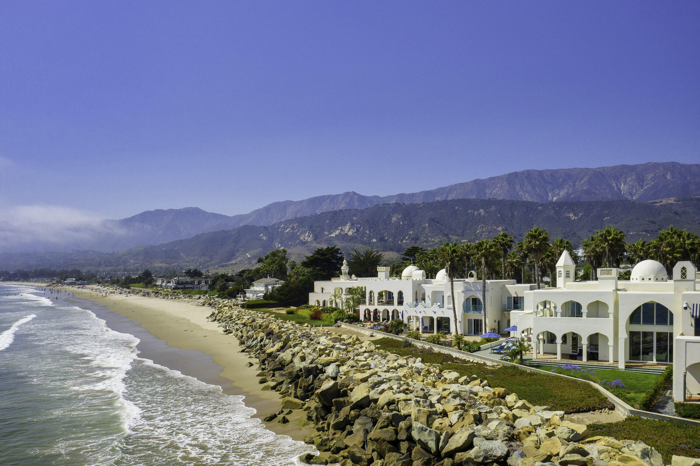 a view of a town with mountains in the background
