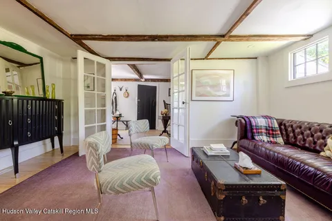 a living room with furniture and a rug