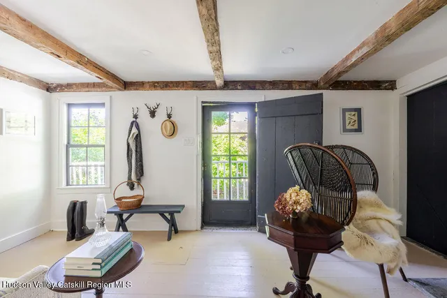 a view of a livingroom with furniture and windows
