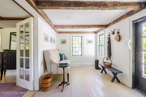 a view of a livingroom with couch and a window