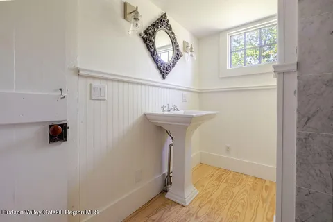 a bathroom with a sink and a mirror