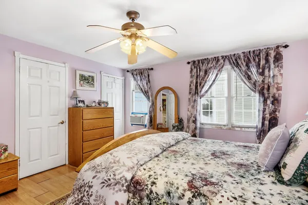 a bed room with a bed and a chair