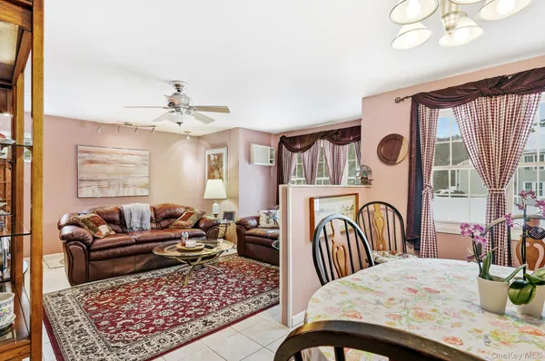 a living room with furniture fireplace and flat screen tv